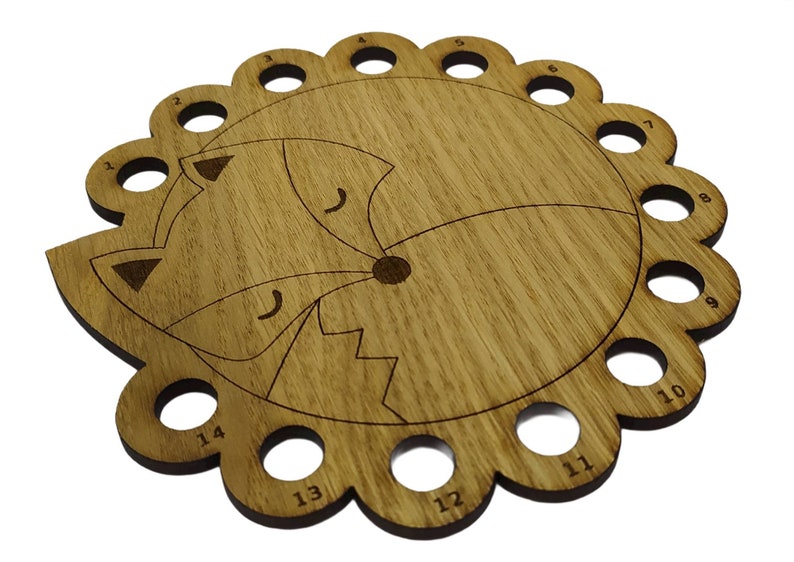 Curled up fox thread holder with 14 holes for thread