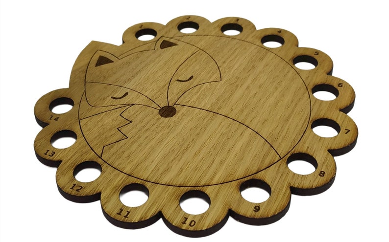 Curled up fox thread holder with 14 holes for thread
