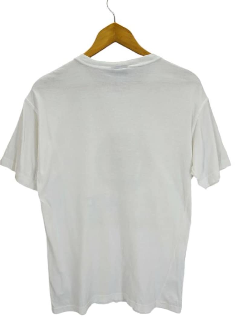 May include: A plain white t-shirt hanging on a wooden hanger. The short-sleeved shirt is made of a soft material and is displayed against a white background. The shirt is a basic, versatile garment.