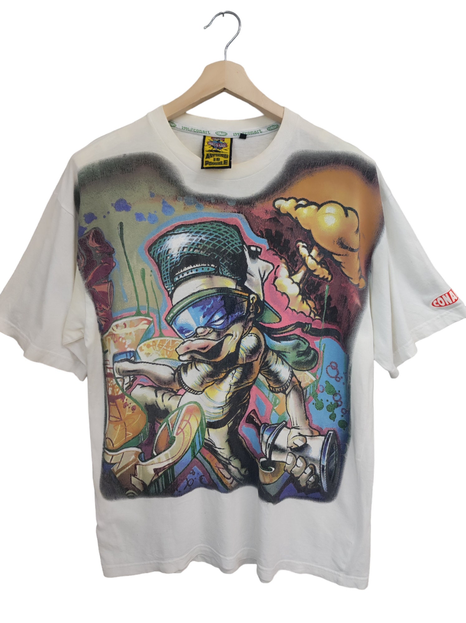 COVERNATのCool Cotton Kitsch Cocktail Graphic T-Shirt 全2色 Vintage 1991 Conart Graffiti Pop Artist T- Shirt Conart Pop