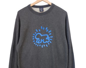 Sudadera vintage Keith Haring de los años 00 con cuello redondo y estampado de Keith Haring de la escena pop art vintage de Keith Haring. Talla extra grande.