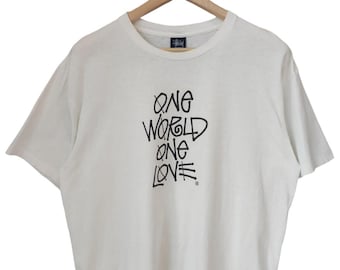 Vintage 90s Stussy Rasta revolucionario Stussy One World one love ' Colaboración Stussy Rasta Street wear Stussy X Large hecho en EE. UU.