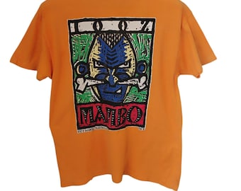 Vintage anni '90 Mambo Australia Mambo 100% per cento australiano teschio mambo negozio di surf australiano T-shirt arancione media mambo tribù teschio e ossa