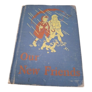May include: A vintage book titled "Our New Friends" with a blue cover. The cover illustration shows two children and a dog running in the rain. The title is in orange lettering.