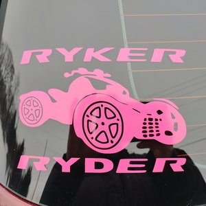 May include: Pink vinyl decal with the name "Ryker Ryder" and a silhouette of a three-wheeled vehicle.