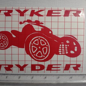 May include: Red vinyl decal of a three-wheeled vehicle with the word "RYKER" above and "RYDER" below the vehicle.