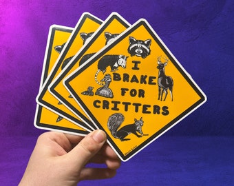May include: Four yellow and black warning signs with the text "I Brake For Critters" and images of various animals including a raccoon, opossum, duck, deer, and squirrel.