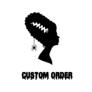 May include: Black and white silhouette of a woman with a hairstyle reminiscent of Frankenstein's monster. A spider dangles from her ear. The text "CUSTOM ORDER" is written in dripping black letters below the silhouette.