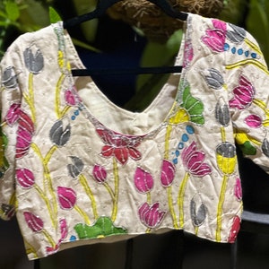 Cream base with beautiful Kalahasti kalamkari on silk blouse. Size  38. Has margin upto 42 inches