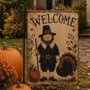 May include: A rectangular garden flag featuring the word WELCOME in black lettering at the top. The illustration depicts a person dressed in a dark pilgrim outfit holding a staff, standing next to a turkey, a small pumpkin, and autumn foliage.