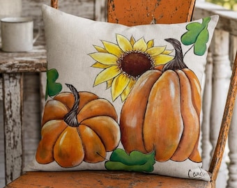 Two Orange Pumpkins and a Sunflower Printed from Original Hand Painted Design on a Premium Pillow. Double Sided with Insert