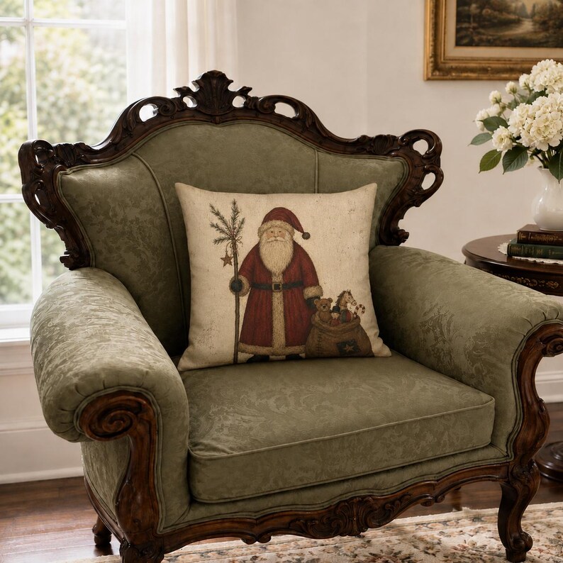 May include: A square throw pillow featuring a printed illustration of Santa Claus wearing a red coat and hat, holding a staff with a star, and carrying a sack filled with toys, set against a light beige background with a textured appearance.