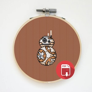 May include: A cross-stitch pattern of BB-8, a droid from the Star Wars franchise. The pattern is in a PDF format and is ready to be downloaded.
