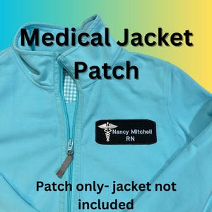 May include: A light blue medical jacket with a black patch that says "Nancy Mitchell RN" and a medical symbol. The text "Medical Jacket Patch" is at the top of the image and the text "Patch only - jacket not included" is at the bottom of the image.