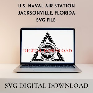 May include: A laptop displays a black and white U.S. Naval Air Station Jacksonville, Florida logo. The screen shows a triangular emblem with text and a stylized eagle. The words "DIGITAL DOWNLOAD" are visible on the screen and below the laptop.