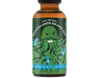 May include: A brown glass bottle with a black dropper top. The label is green and features a cartoon illustration of a man with a green beard. The text on the label reads "100% NATURAL WOODLANDS BEARD CO. FOREST WISP BEARD OIL NET 1 FL. OZ (30ML)"