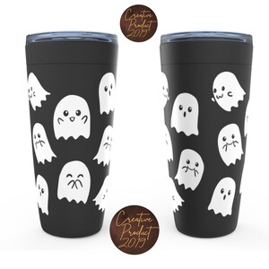 May include: Two black travel mugs with a white ghost pattern. The ghosts have different facial expressions. The mugs have a black lid and a silver band around the top.