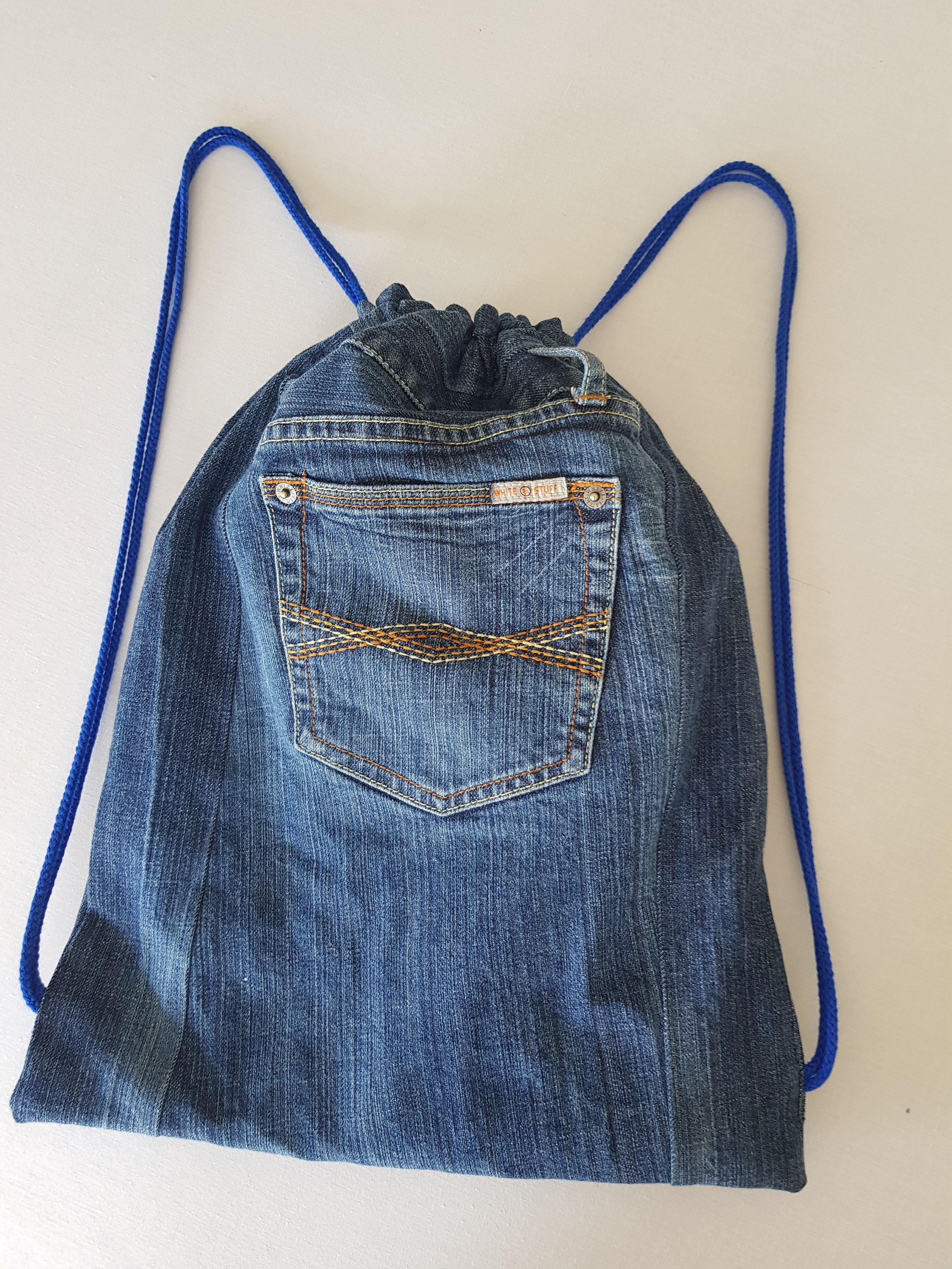 Blue denim draw string bag. pockets front and back. Etsy