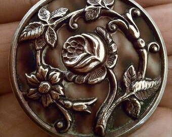 3.5cm. 1 repousse button,antique picture button,trailing rose design with black and white color backing