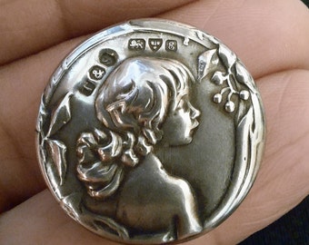 1 Early 1900s Edwardian Button of a child. Art Nouveau on Silver. Hallmarked Chester 1905.  2.4 cm diameter. No 4 reserved.