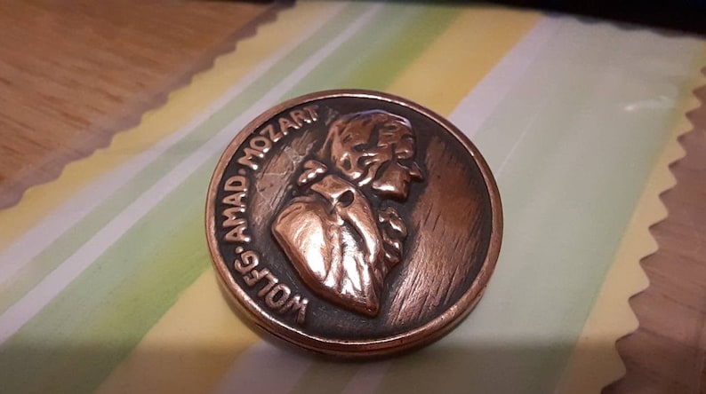 1 antique mozart music composer head button Copper fitted 1 inch diameter.
