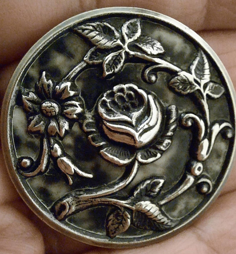 3.5cm. 1 repousse button,antique picture button,trailing rose design with black and white color backing