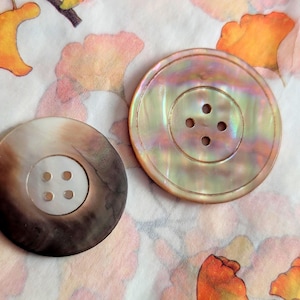 2 buttons, Large mother of pearl, antique hand-carved. 3.5cm and 3cm diameters.