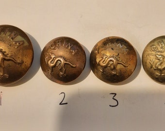 4 x buttons of Chinese dragon. 2 small ones at 1.9cm and a large one at 2.5cm diameter.