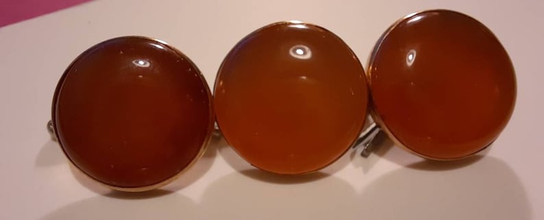 16 to 18mm diameter. 3 stunning cornelian and rose gold c1900s buttons