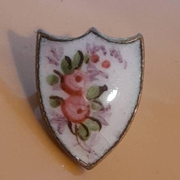 Button 1 champleve enamel with pink flowers on gilt sheild. Small 1cm by 8mm diameter.