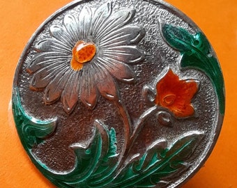 1 Deccan button in silver of gerbera with orange and green enamel glass detail. 2cm diameter.