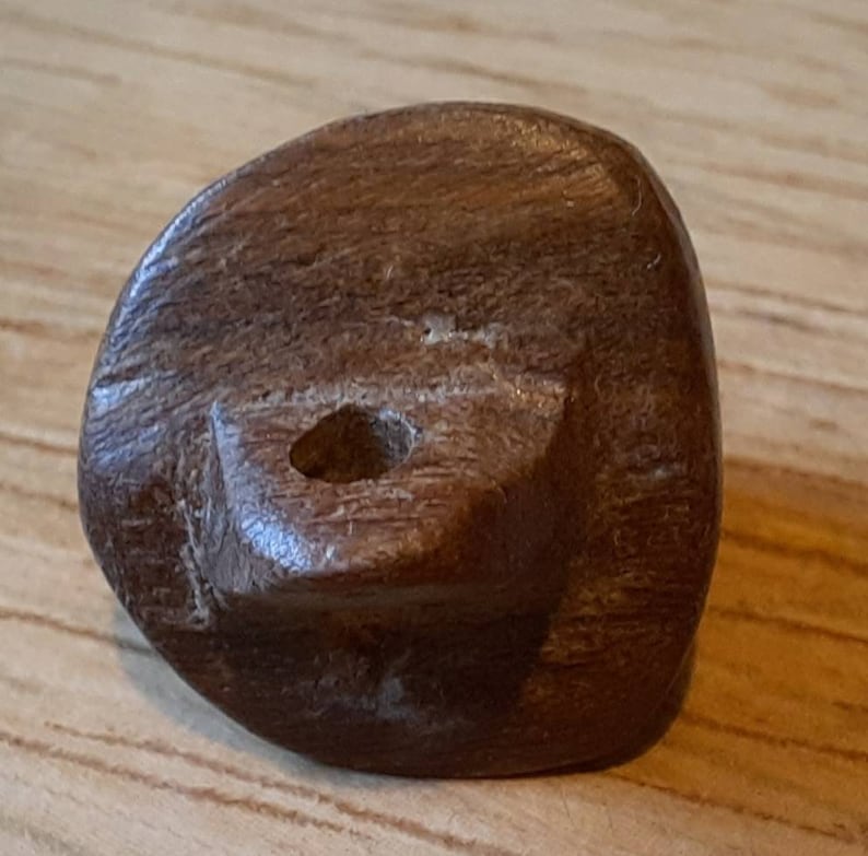1 elephant hand carved wood button 15mmby 14mm.