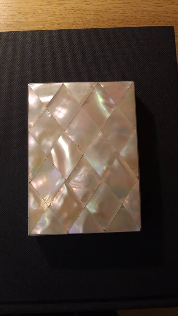 1 stunning mother-of-pearl purse or card holder. A