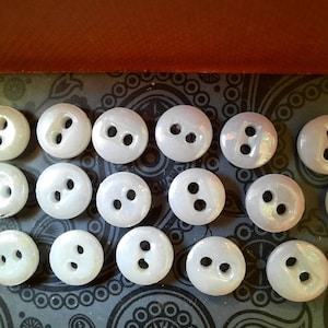 30 tiny 1930s china buttons. 7mm diameter.