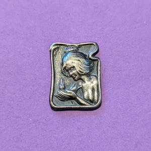 C 1902 art nouveau button of girl with bird in hand. 2.7cm long by 1.2cm wide. William Huttan . image 1