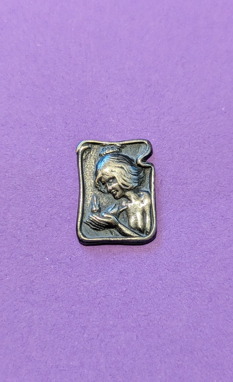 C 1902 art nouveau button of girl with bird in hand. 2.7cm long by 1.2cm wide. William Huttan . image 1