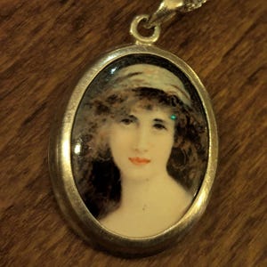 Enameled portrait pendant necklace  925 Silver. 3cm oval. Chain 9 inch drop.