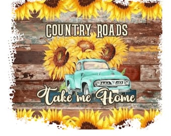 May include: A rustic design featuring a teal pickup truck, sunflowers, and the text "Country Roads Take Me Home." The background has a wooden plank texture, and the image is framed with yellow sunflowers.