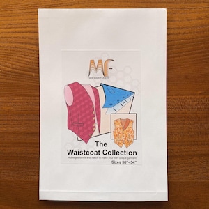 May include: A white paper pattern envelope with a colourful illustration of a waistcoat. The text on the envelope reads "The Waistcoat Collection" and "Sizes 38"-54".