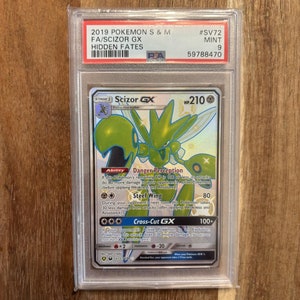 May include: A Scizor GX Pokemon card from the Hidden Fates expansion set. The card is holographic and features a green and white Scizor with a blue background. The card's text includes the abilities Danger Perception and Steel Wing, as well as the GX attack Cross-Cut GX.
