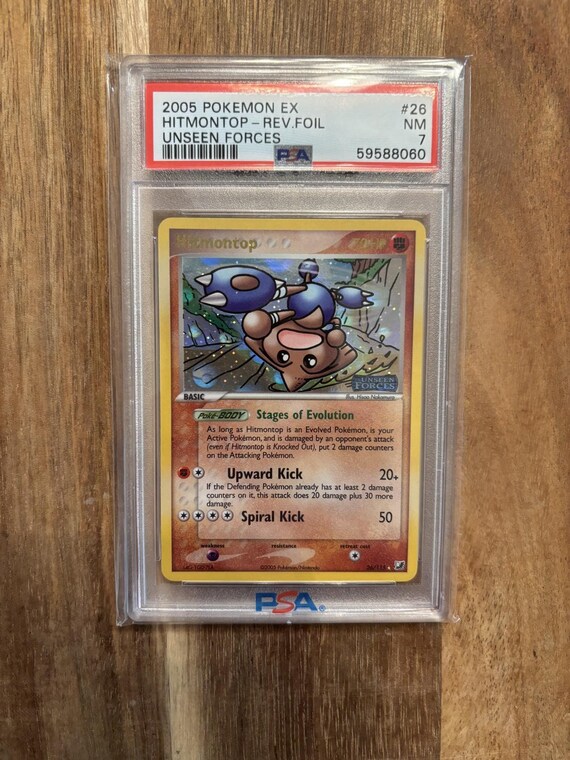 Hitmontop Reverse Holographic Unseen Forces PSA 7 – Rare