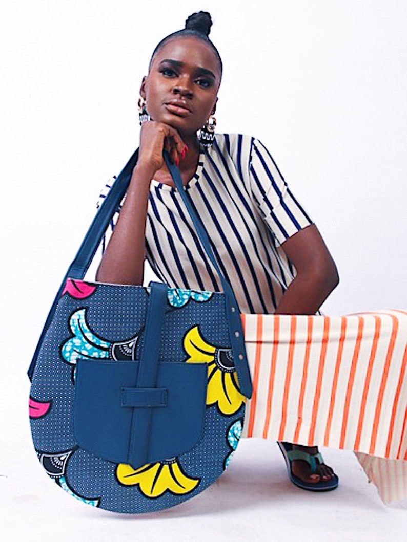Akoa handcrafted African prints bag Statement wax print bag Stylish work bag Oval shaped handbag Sturdy shoulder bag for women Navy + Flower motif