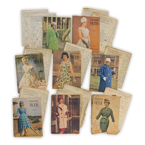 May include: A selection of vintage fashion magazines and pattern sheets. The magazines showcase women in fashionable attire, with covers in diverse colours. The text "PRAKTISCHE MODE" is displayed on the magazine covers. Pattern sheets are scattered around the magazines.