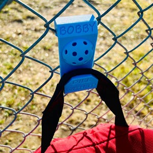 May include: A set of three ceramic mugs with a speckled, matte finish. The mugs are in shades of cream, light gray, and dark gray. Each mug has a simple, minimalist design and a rounded handle.