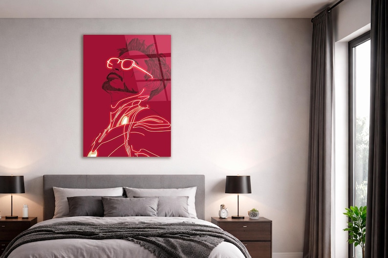 Puede incluir: Una impresi&oacute;n art&iacute;stica de pared roja con una ilustraci&oacute;n estilizada de una persona con gafas, barba y un dise&ntilde;o futurista. La obra de arte est&aacute; delineada en un color ne&oacute;n brillante.