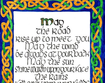 May include: A Celtic knot border surrounds a handwritten poem in black ink on a white background. The poem reads: "May the road rise up to meet you. May the wind be always at your back. May the sun shine warm upon your face. The rains fall soft upon your fields and until we meet again may God hold you in the palm of his hand."