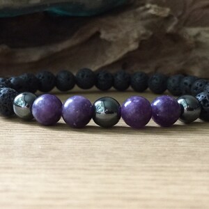 Artisan crafting men’s lepidolite hematite and lava stone bracelet by hand