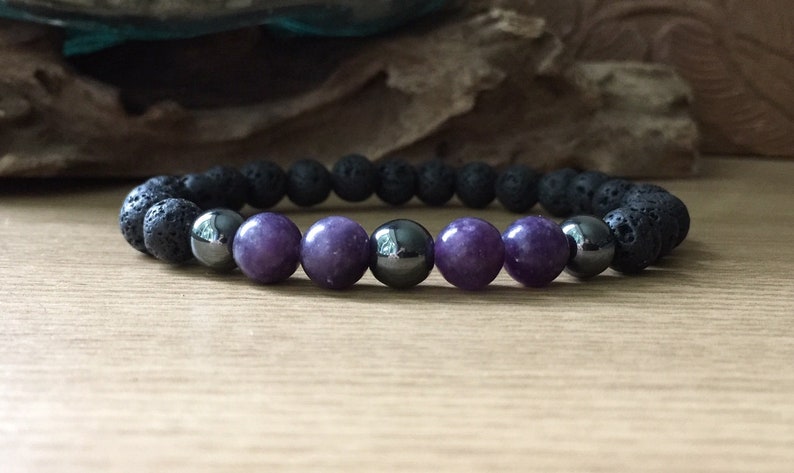 Artisan crafting men’s lepidolite hematite and lava stone bracelet by hand
