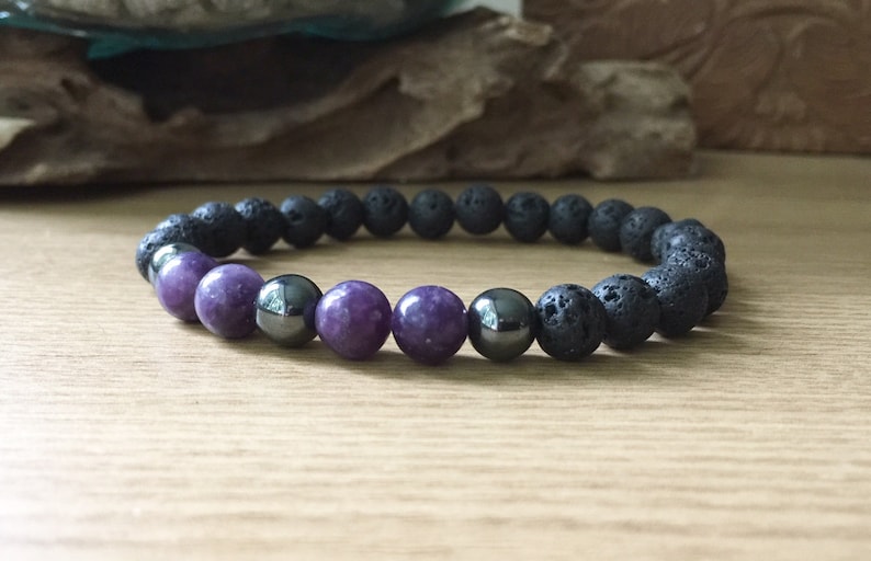 Handmade men’s bracelet with lepidolite, hematite, and lava rock beads for stress relief and balance.