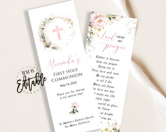 May include: A pink and green floral design bookmark with a gold glitter background. The bookmark features a cross and the text "Hear My Lord's Prayer". The text "Father in heaven, hear my prayer. Keep me in your love and care. Be my guide in all I do. Bless all those to love me too. So make my life little light, world to glow. The flame so bright, may go." is also included.